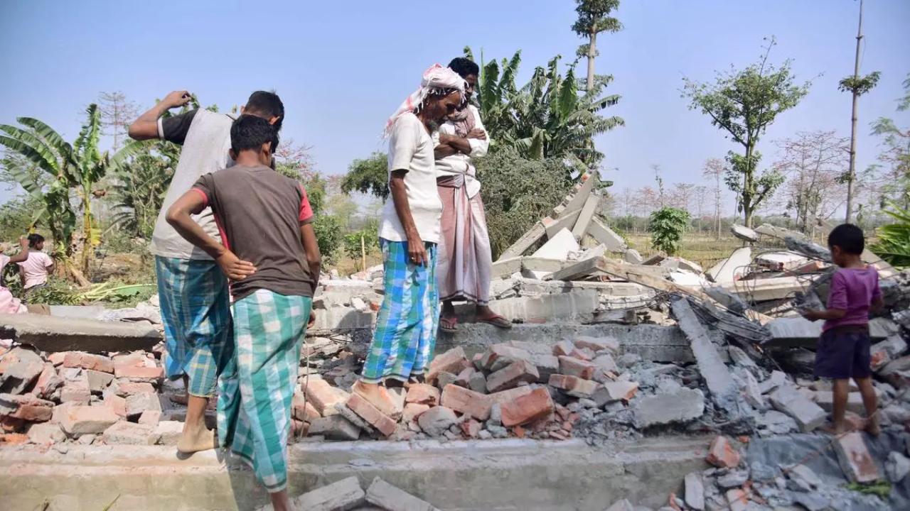 Residents leave with belongings from Lutumari Longjap Reserve Forest after Assam demolition drive
