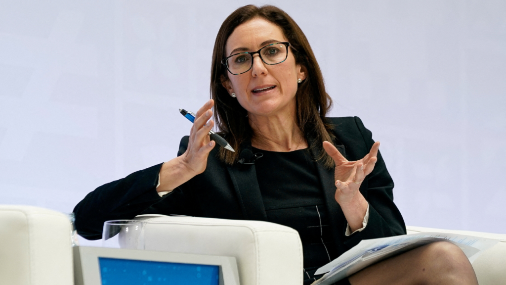 Silvana Tenreyro: AI boom in global trade shown by cargo containers and computer chips at a busy port