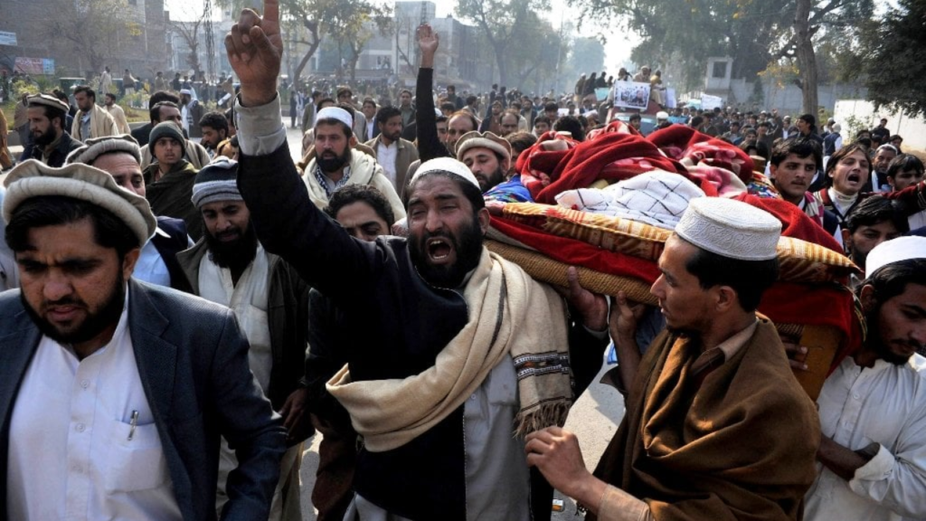 Police and protesters during clashes over governor’s rule in Khyber Pakhtunkhwa