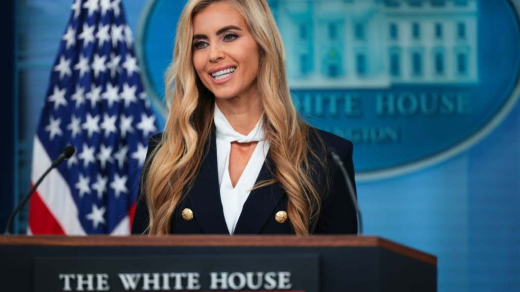 Katie Zacharia press secretary speaking at the White House briefing room podium